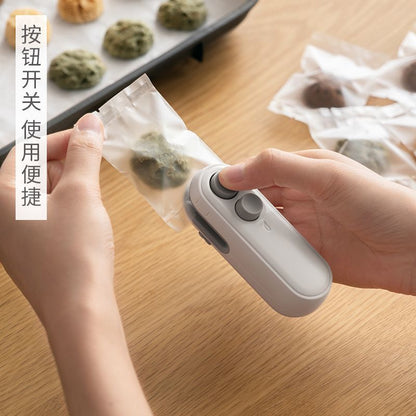 (VIDEO) New Mini Sealing Machine Magnetic Charging Household Snack Freshness Sealing God Multi functional Small Sealing Machine