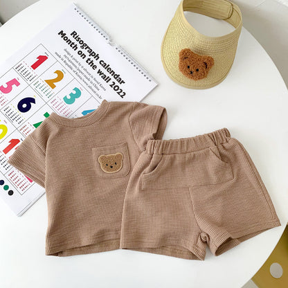 A summer thin baby Korean short-sleeved shorts cotton and linen pit strip suit for boys and girls round neck pullover two-piece suit