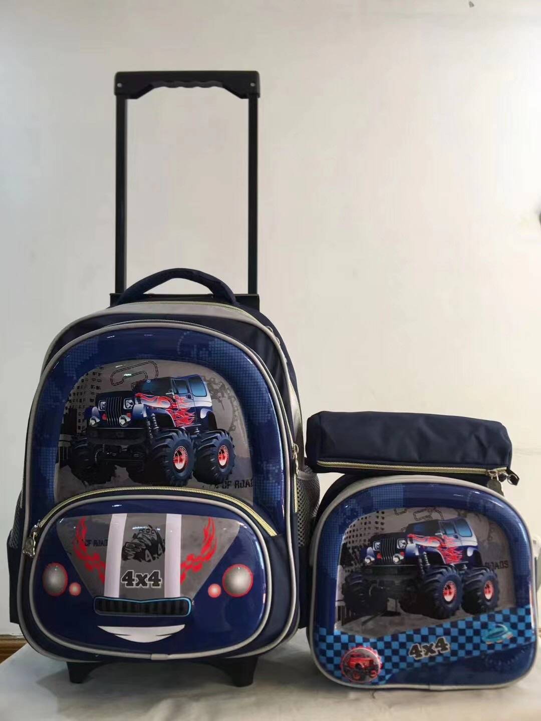 Un conjunto de tres piezas de mochila con barra de tracción, mochila de PU de 16 pulgadas para estudiantes, estuche para lápices, mochila mediana, mochila para niños, poste cuadrado de tres ruedas 