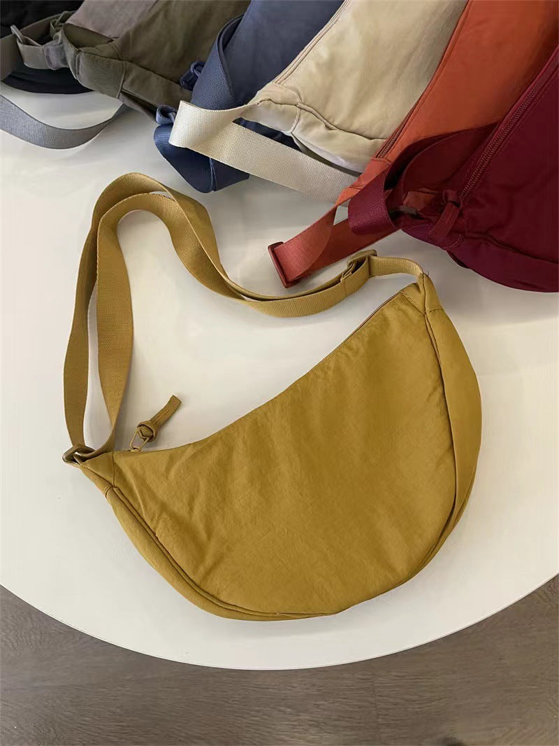 A Youjia fitting room with the same female messenger bag Xiaohongshu nylon dumpling bag student shoulder bag cloth bag factory supply