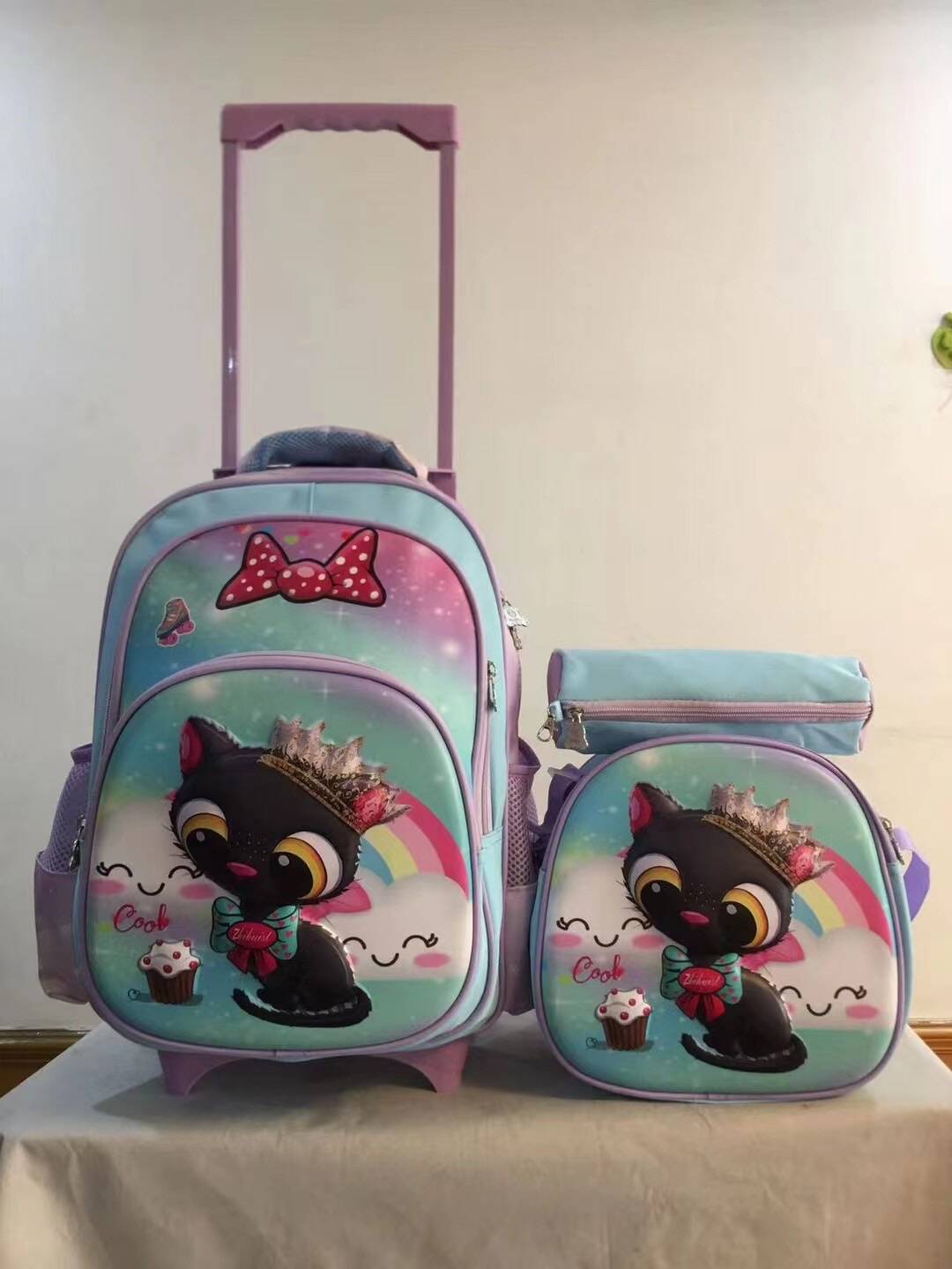 A three piece set of pull rod backpack, student 16 inch PU backpack, pencil case, medium backpack, children's backpack, three wheel square pole