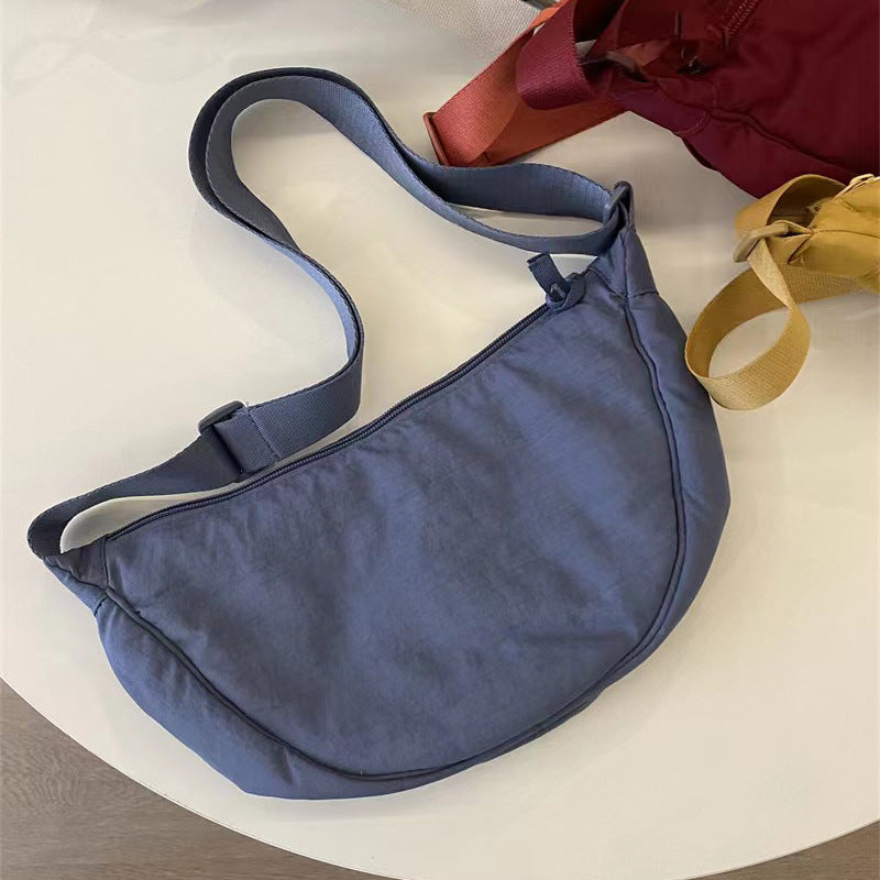 A Youjia fitting room with the same female messenger bag Xiaohongshu nylon dumpling bag student shoulder bag cloth bag factory supply