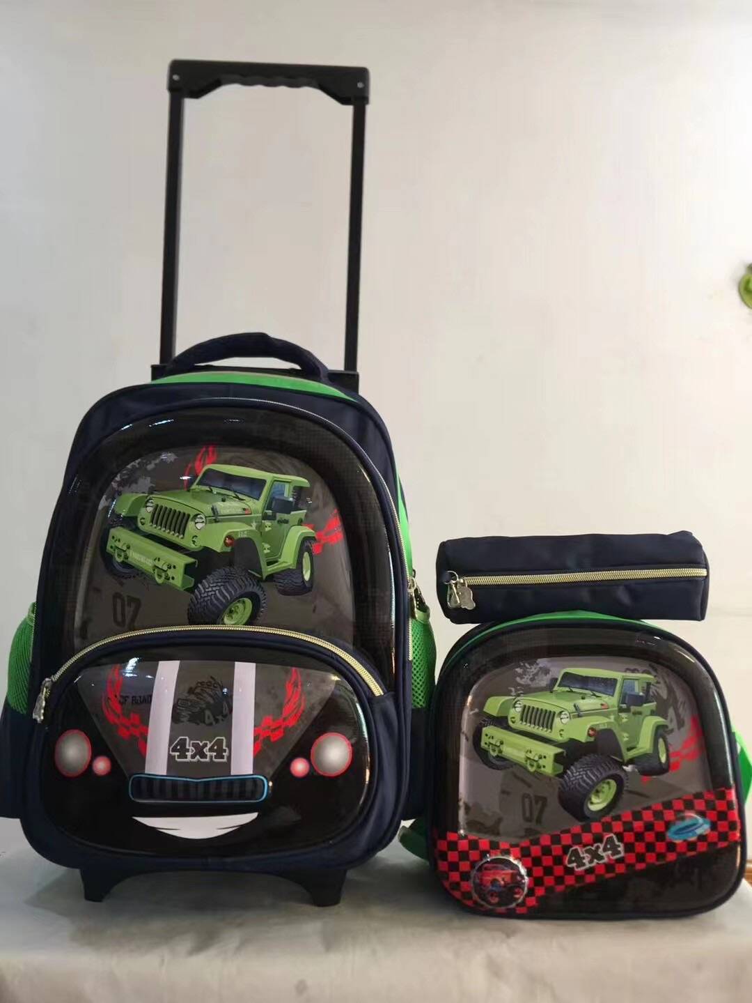 A three piece set of pull rod backpack, student 16 inch PU backpack, pencil case, medium backpack, children's backpack, three wheel square pole