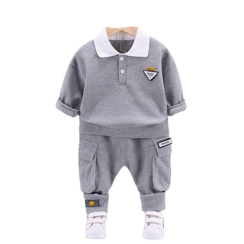 A children's clothing spring new baby boy solid color casual foreign style two buckles lapel long sleeve two-piece set wholesale