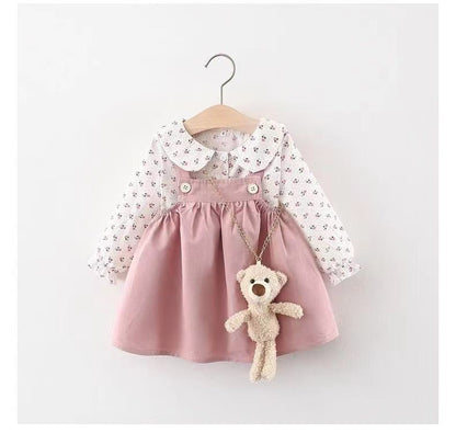 Venta al por mayor de ropa infantil para niñas, blusa con estampado floral y falda con tirantes de osito de peluche, nuevo conjunto de dos piezas de otoño A421 