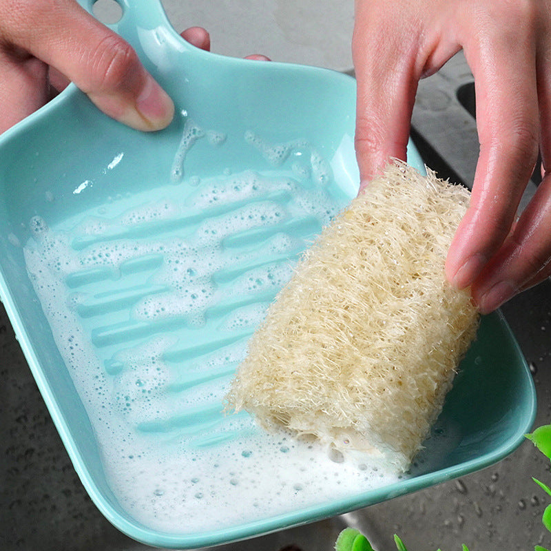 Una esponja vegetal, un cepillo para fregar, un artefacto, un paño de cocina que no mancha, un paño de cocina, una esponja vegetal natural, un estropajo 