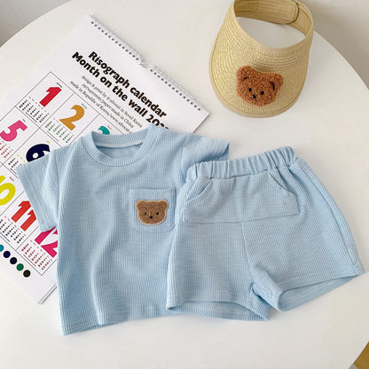 A summer thin baby Korean short-sleeved shorts cotton and linen pit strip suit for boys and girls round neck pullover two-piece suit