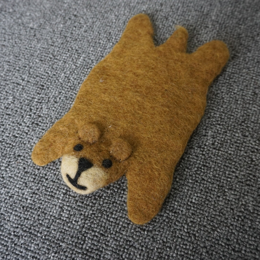 A wool felt animal placemat