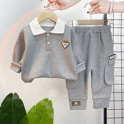 A children's clothing spring new baby boy solid color casual foreign style two buckles lapel long sleeve two-piece set wholesale