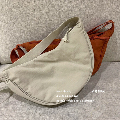 A Youjia fitting room with the same female messenger bag Xiaohongshu nylon dumpling bag student shoulder bag cloth bag factory supply