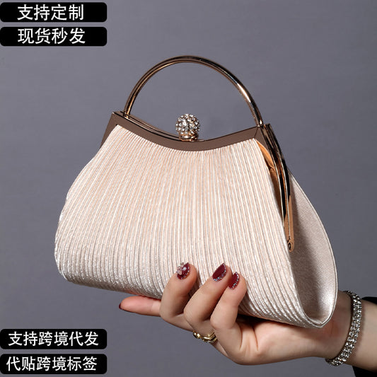 A Europe and America retro solid color pleated hand ring fashion lock closed dinner bag chain messenger bag studded bag.