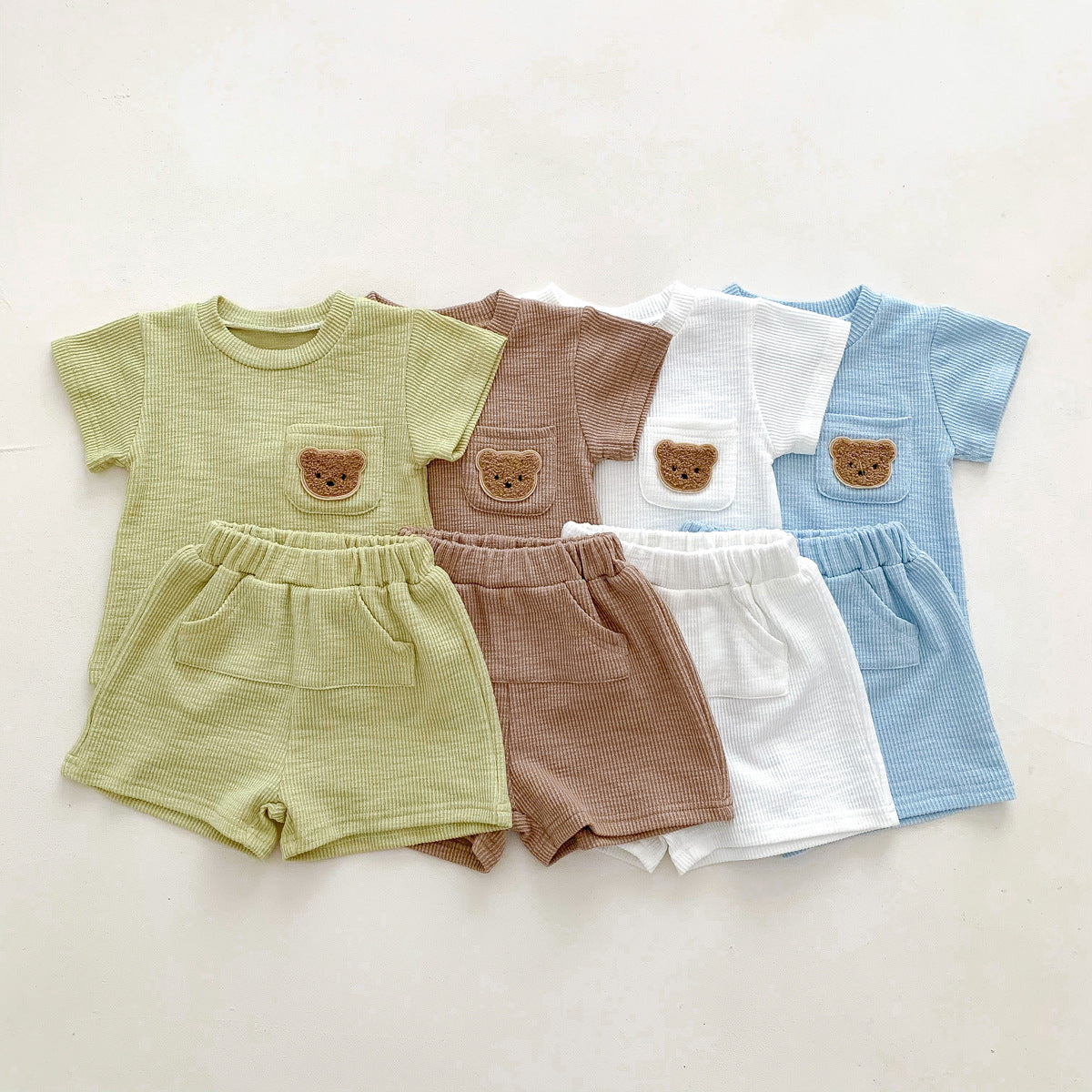 A summer thin baby Korean short-sleeved shorts cotton and linen pit strip suit for boys and girls round neck pullover two-piece suit