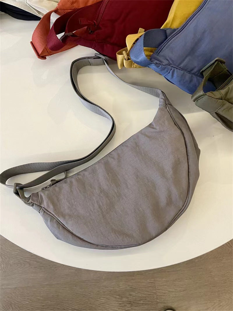 A Youjia fitting room with the same female messenger bag Xiaohongshu nylon dumpling bag student shoulder bag cloth bag factory supply