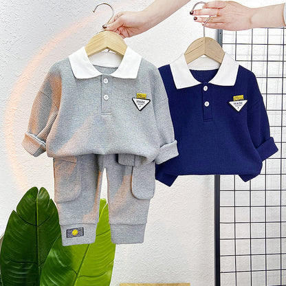 A children's clothing spring new baby boy solid color casual foreign style two buckles lapel long sleeve two-piece set wholesale