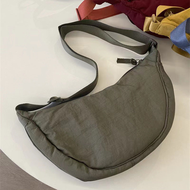 A Youjia fitting room with the same female messenger bag Xiaohongshu nylon dumpling bag student shoulder bag cloth bag factory supply