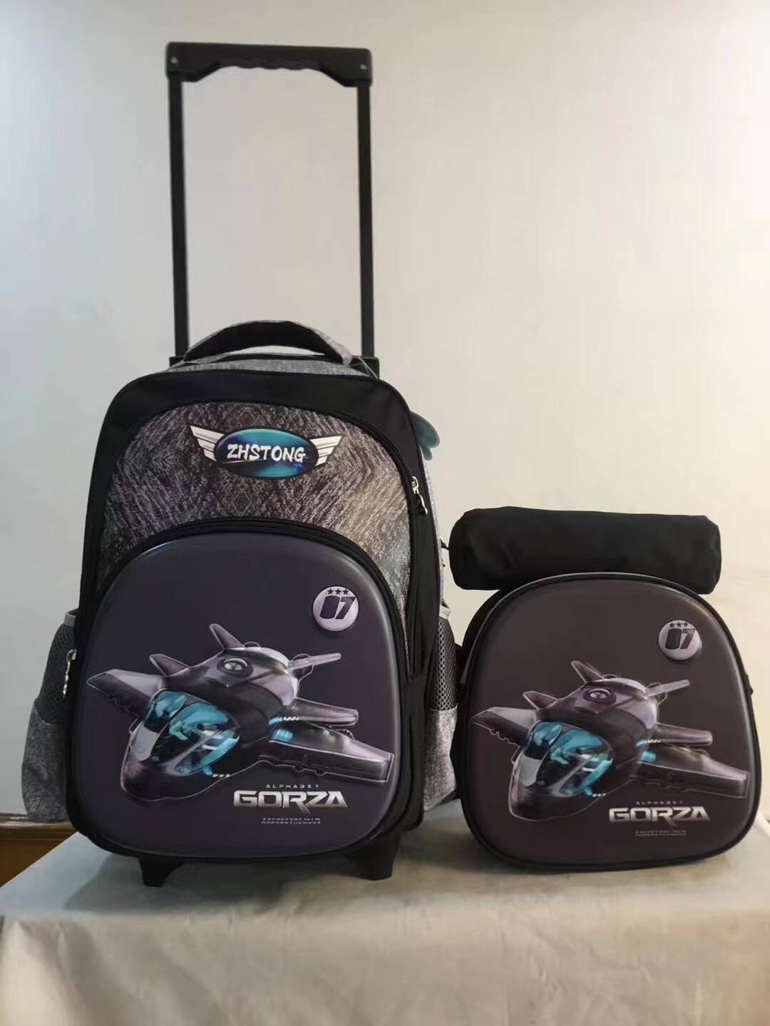 Un conjunto de tres piezas de mochila con barra de tracción, mochila de PU de 16 pulgadas para estudiantes, estuche para lápices, mochila mediana, mochila para niños, poste cuadrado de tres ruedas 