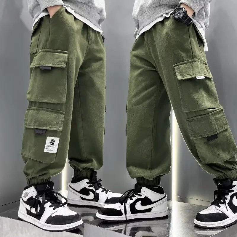 A boys pants spring and autumn 2024 children's overalls spring and autumn middle-aged older boys ruffian handsome gas tied feet trousers tide