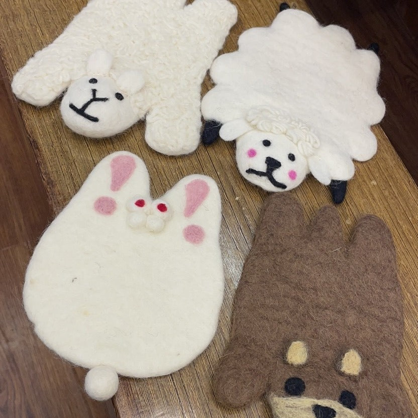 A wool felt animal placemat