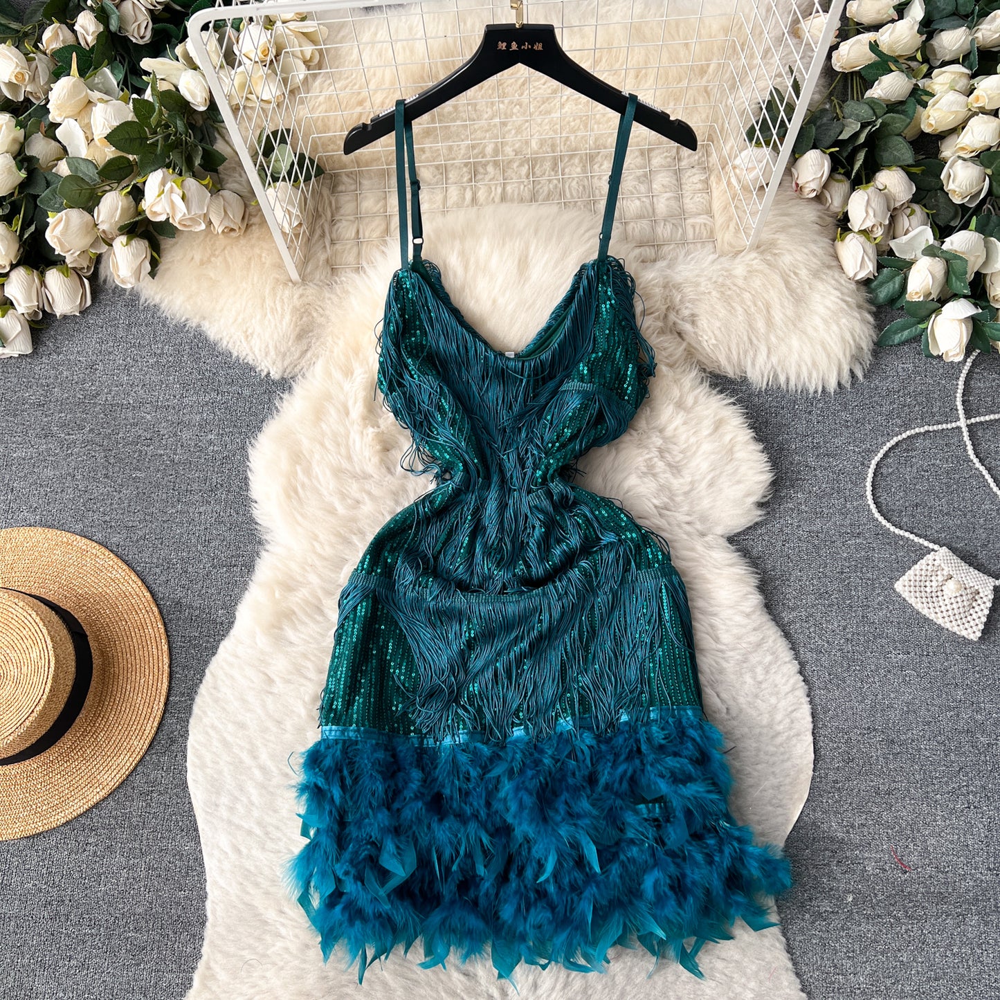 A feather splicing sequined dress women's European and American ins high-end dress sexy halter waist suspender fringed skirt