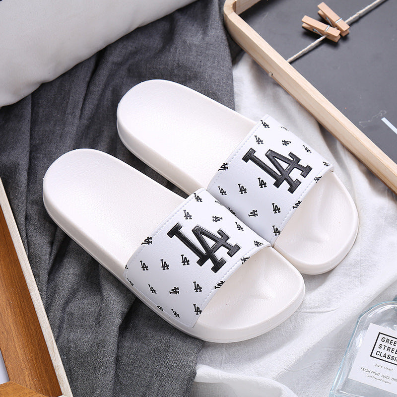 A home slippers indoor anti-slip sandals summer wear casual wear-resistant slippers couple fashion trend female drag.