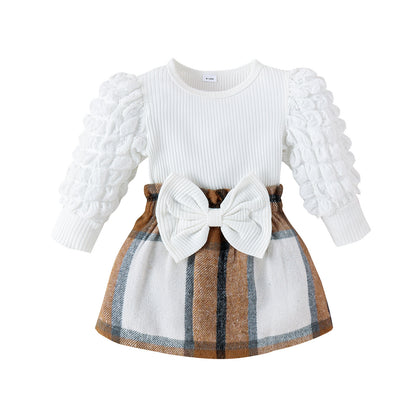 Ropa infantil Treasure Salary Transfronteriza Europa y América Otoño e invierno Nuevo bebé y niño Blusa de manga abullonada Falda corta con lazo a cuadros Conjunto de dos piezas 0,22 kg 