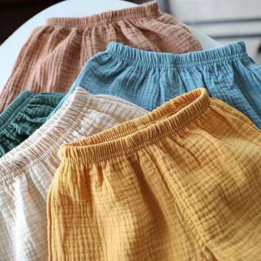 Pantalones cortos para niños, nuevos pantalones elásticos de verano, pantalones sueltos de algodón y cáñamo para niños y niñas, pantalones casuales de estilo occidental para bebés